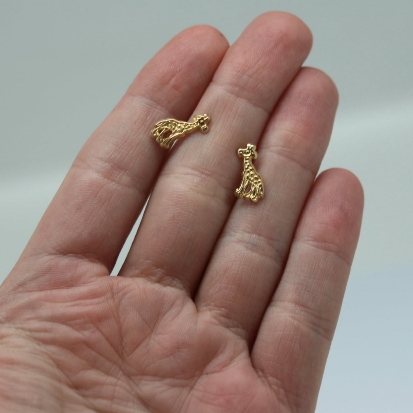 ARETES NIÑAS ORO JIRAFA