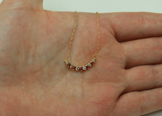 COLLAR MEDIO CIRCULO RUBI Y DIAMANTES